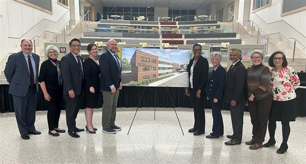 School Board Poses with Bear Hill Elementary School Sign